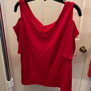 This shirt is Lane Bryant. The size is 18/20. It is a cold shoulder shirt